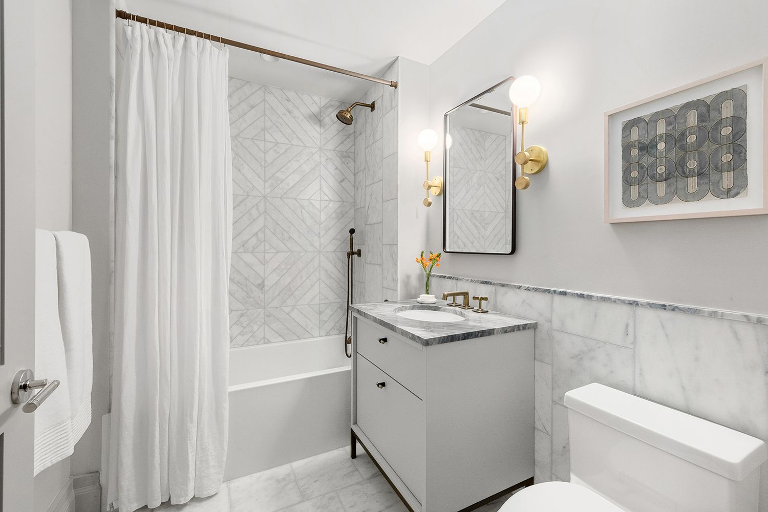76 Schermerhorn Street, Unit 8E Brooklyn, NY 11201 - Photo 7 of 8 a bathroom with a sink a toilet and shower