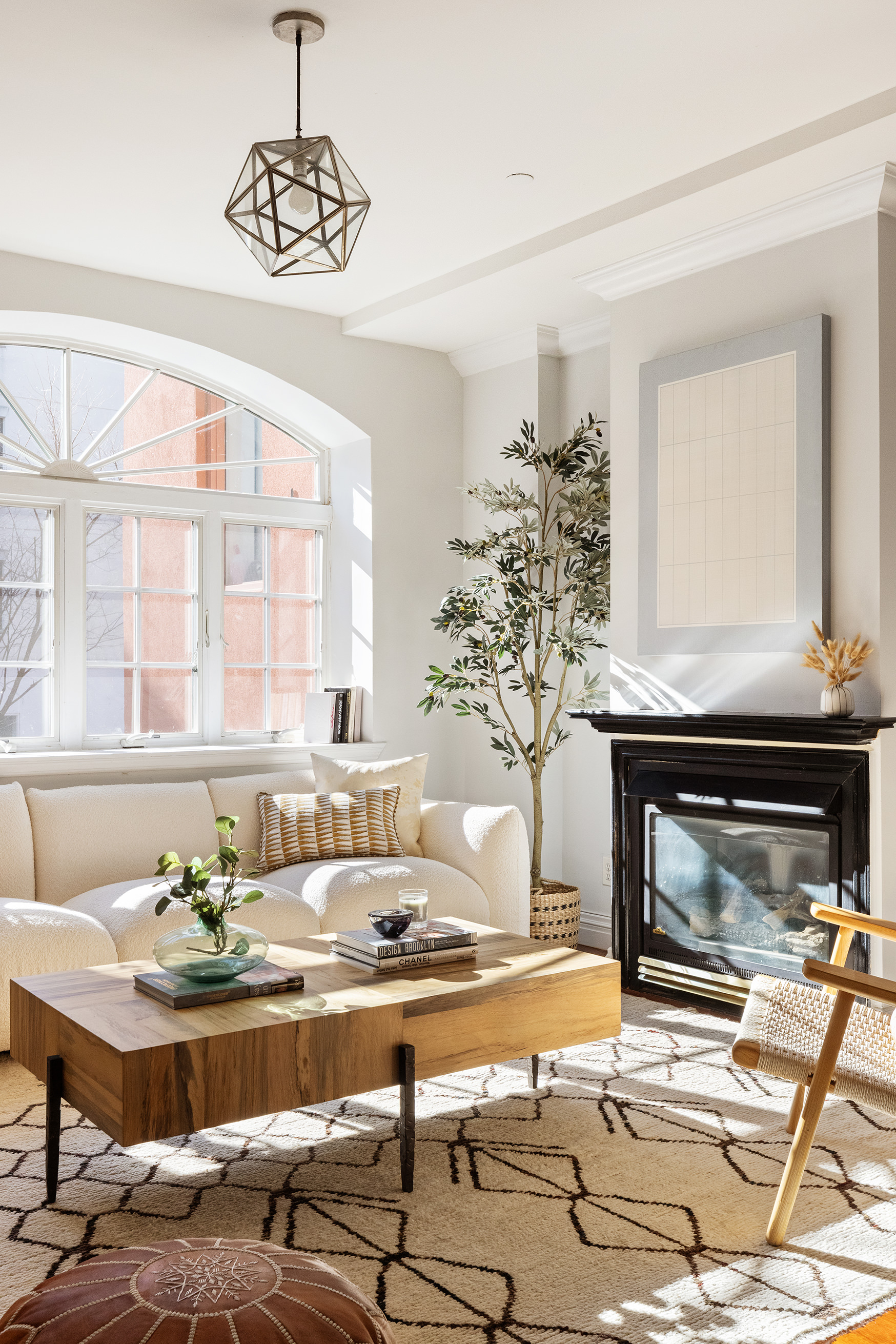 301 Warren Street, Unit 2 Brooklyn, NY 11201 - Photo 4 of 11 a living room with a fireplace and chandelier