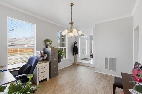 a view of a dining room with furniture window and wooden floor