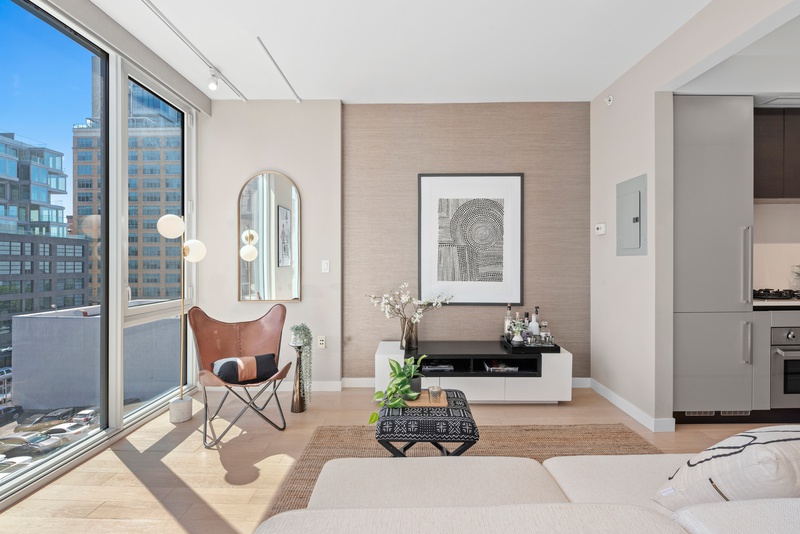 540 West 49th Street, Unit 609N Manhattan, NY 10019 - Photo 4 of 10 a living room with furniture and wooden floor