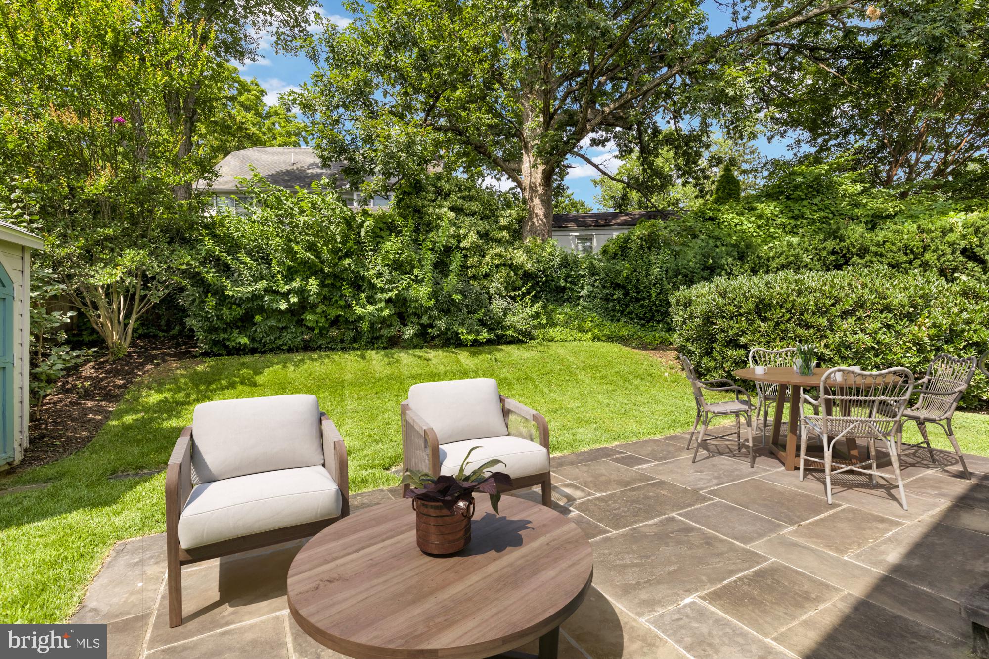 2611 Ross Road Chevy Chase, MD 20815 - Photo 35 of 37 a couple of chairs sitting in a yard with large trees