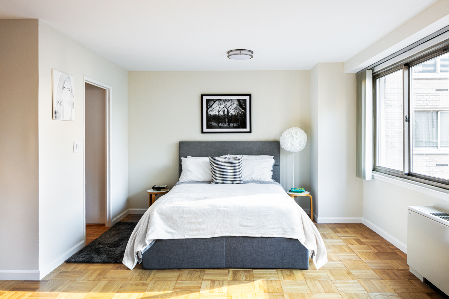 401 East 86th Street, Unit 5M Manhattan, NY 10028 - Photo 3 of 8 a bedroom with a bed and a window