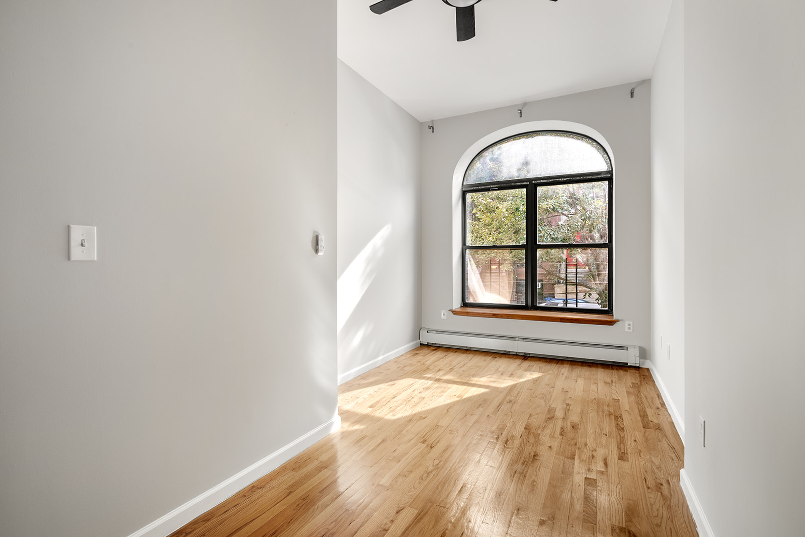 265 West 136th Street Manhattan, NY 10030 - Photo 6 of 14 an empty room with window