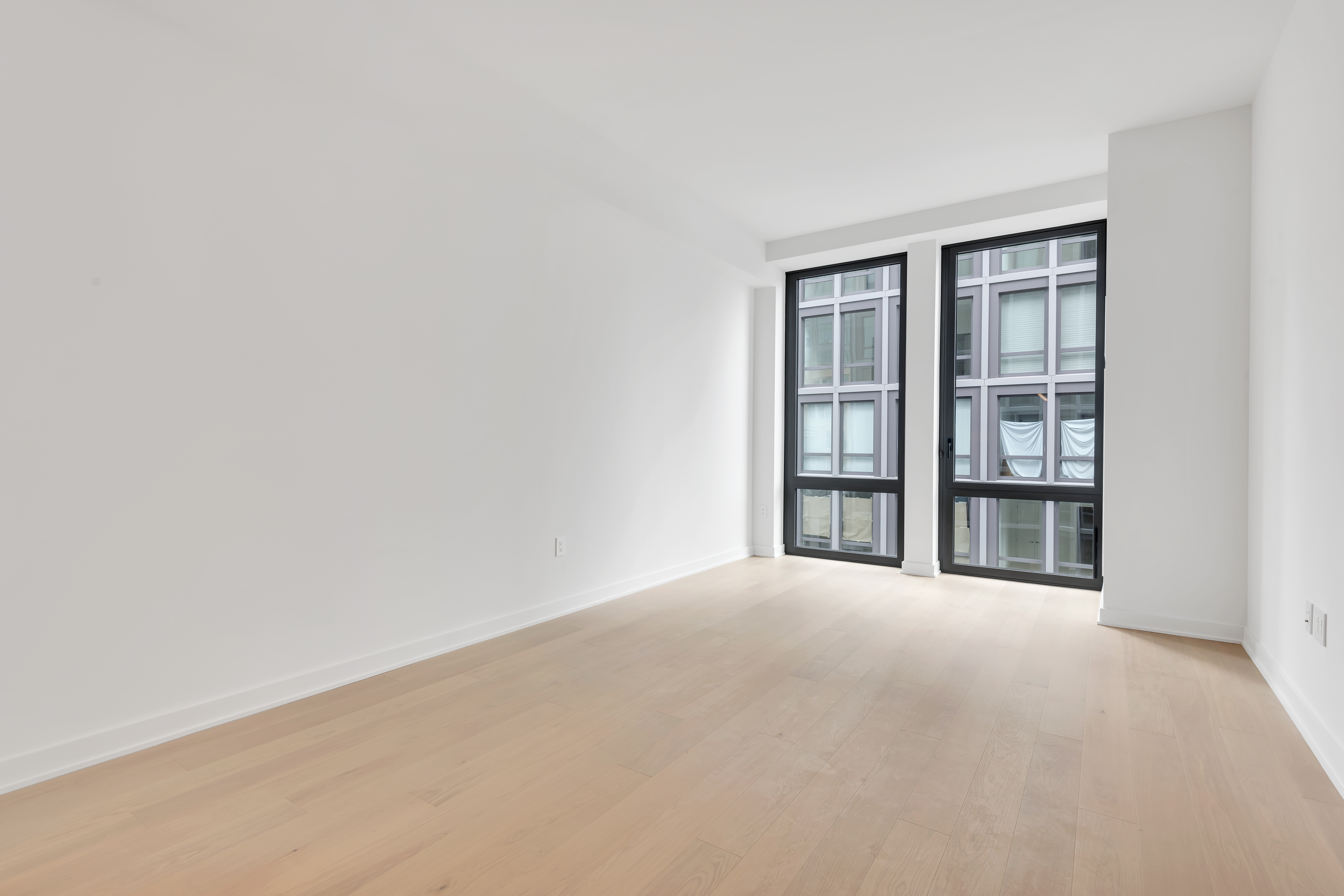 77 Charlton Street, Unit S11G Manhattan, NY 10014 - Photo 1 of 9 a view of an empty room with a window