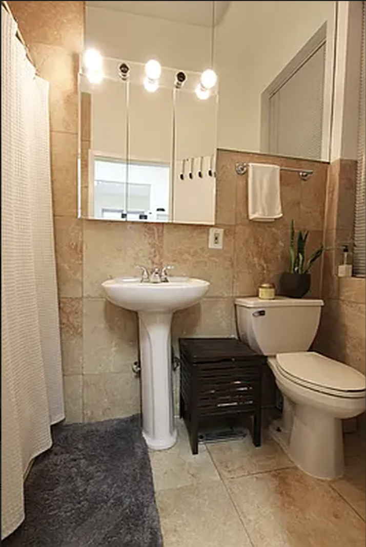 1313 3rd Avenue, Unit 2 Manhattan, NY 10021 - Photo 4 of 4 a bathroom with a sink toilet and shower