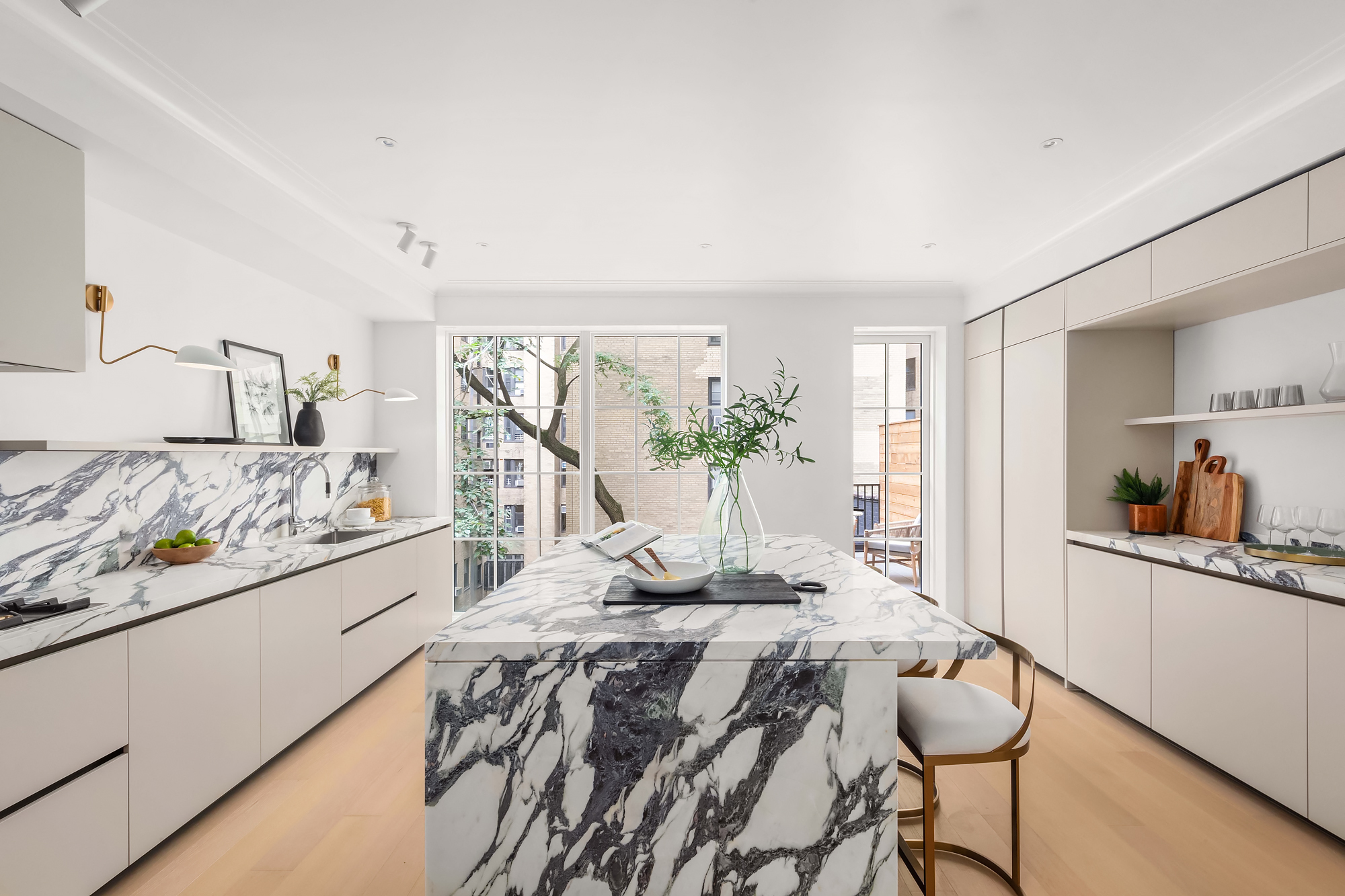 344 West 84th Street, Unit PH Manhattan, NY 10024 - Photo 3 of 11 a living room with kitchen furniture and a wooden floor