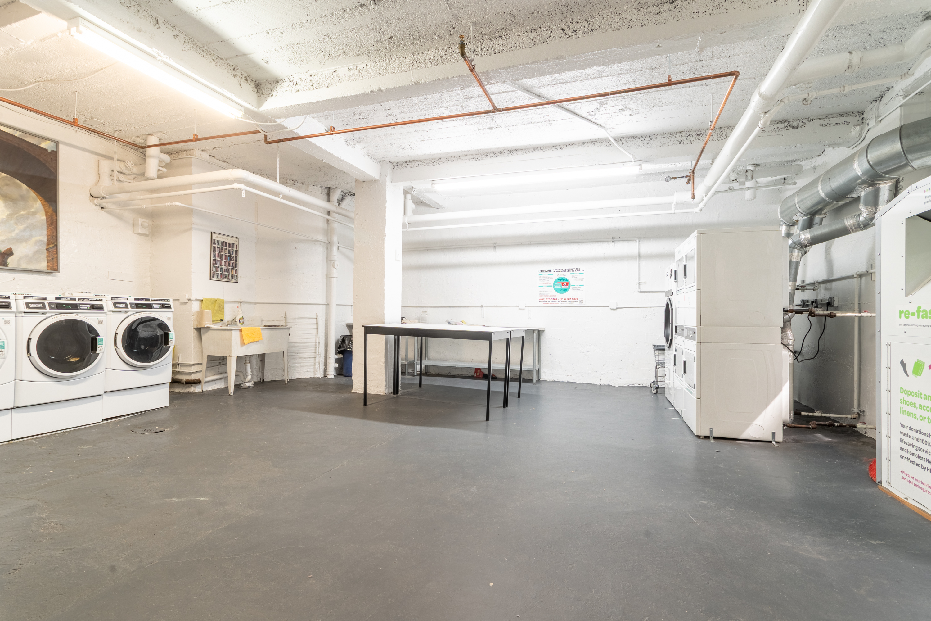 30 Bogardus Place, Unit 2C Manhattan, NY 10040 - Photo 17 of 20 a view of a storage & utility room with two washing machine