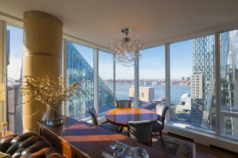 a view of a dining room with furniture window and outside view