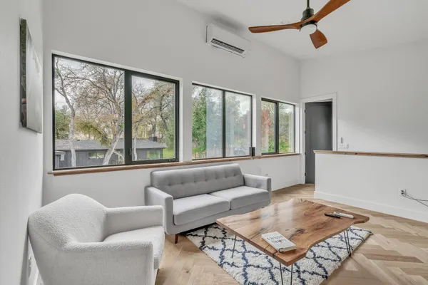 a living room with furniture and a large window
