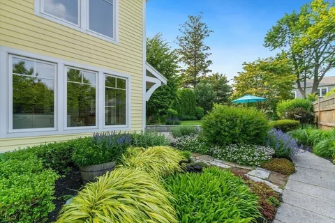 front view of a house with a garden