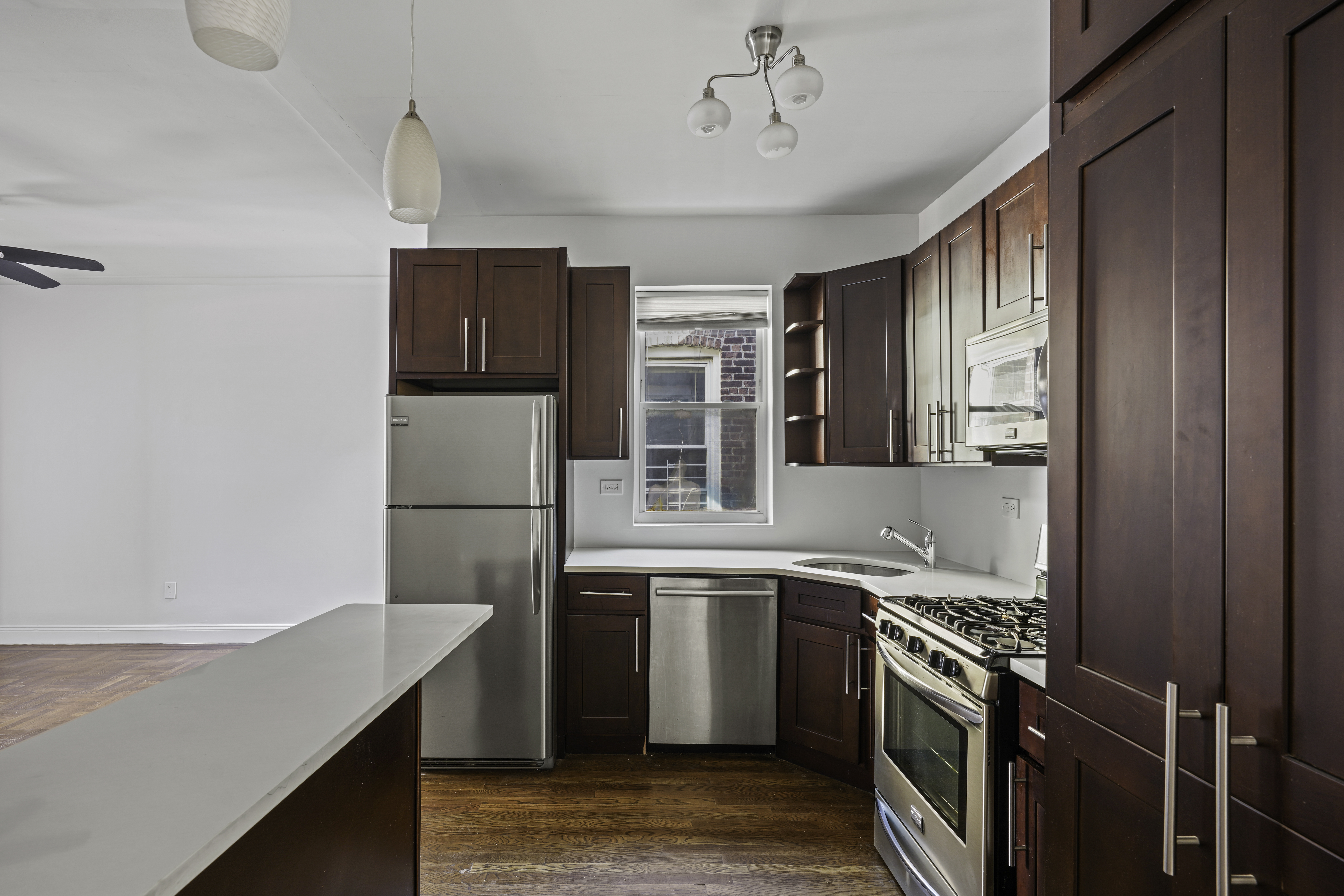 514 86th Street, Unit 4 Brooklyn, NY 11209 - Photo 1 of 19 a kitchen with a sink a stove and refrigerator