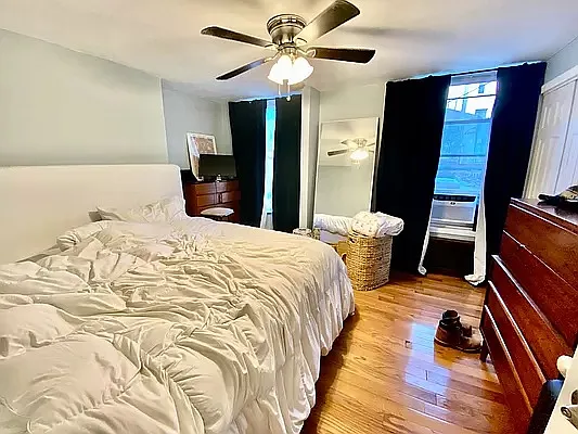 195 Atlantic Avenue, Unit 1 Brooklyn, NY 11201 - Photo 7 of 10 a bedroom with a bed and a flat screen tv