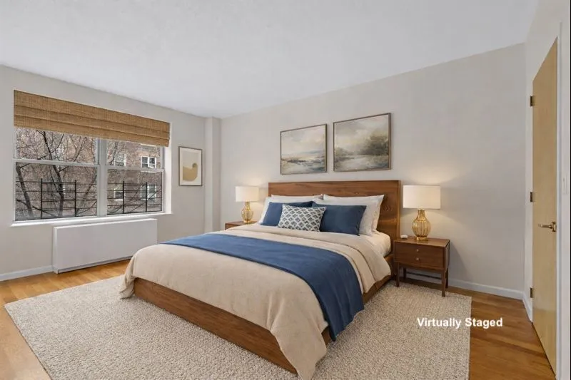 a bedroom with a bed and window