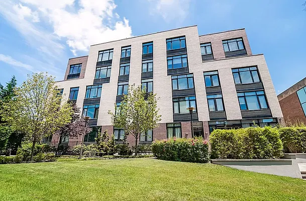 125 North 5th Street, Unit 3D Brooklyn, NY 11249 - Photo 9 of 10 a front view of a multi story residential apartment building