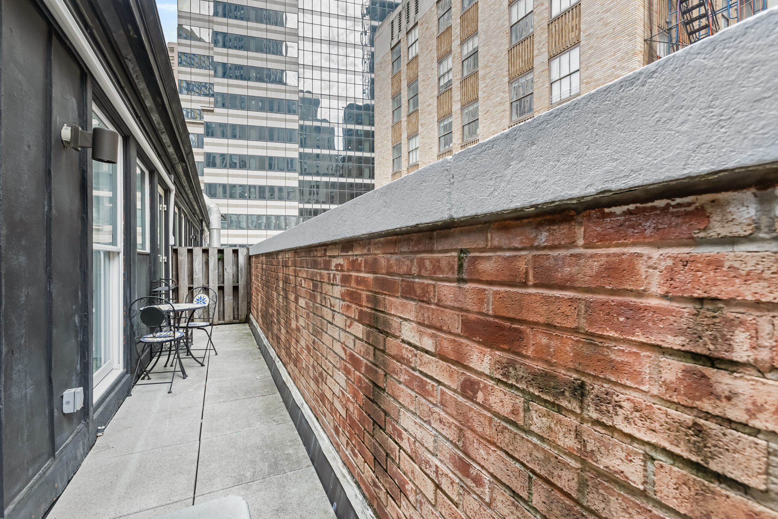 55 Wall Street, Unit PH942 Manhattan, NY 10005 - Photo 8 of 9 a view of wooden balcony