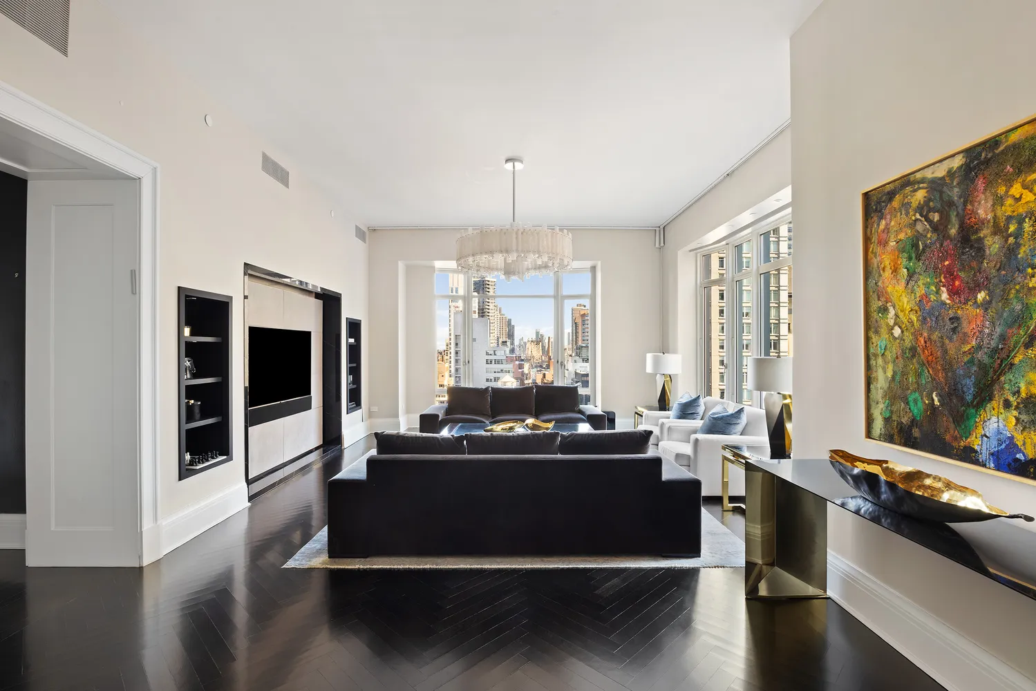a living room with furniture and large windows
