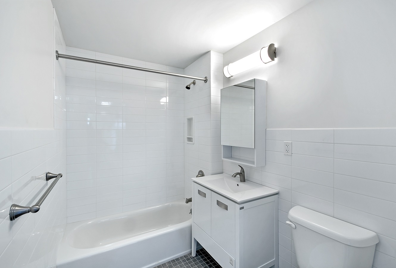 265 Van Brunt Street, Unit 1C Brooklyn, NY 11231 - Photo 4 of 7 a bathroom with a sink a toilet and shower