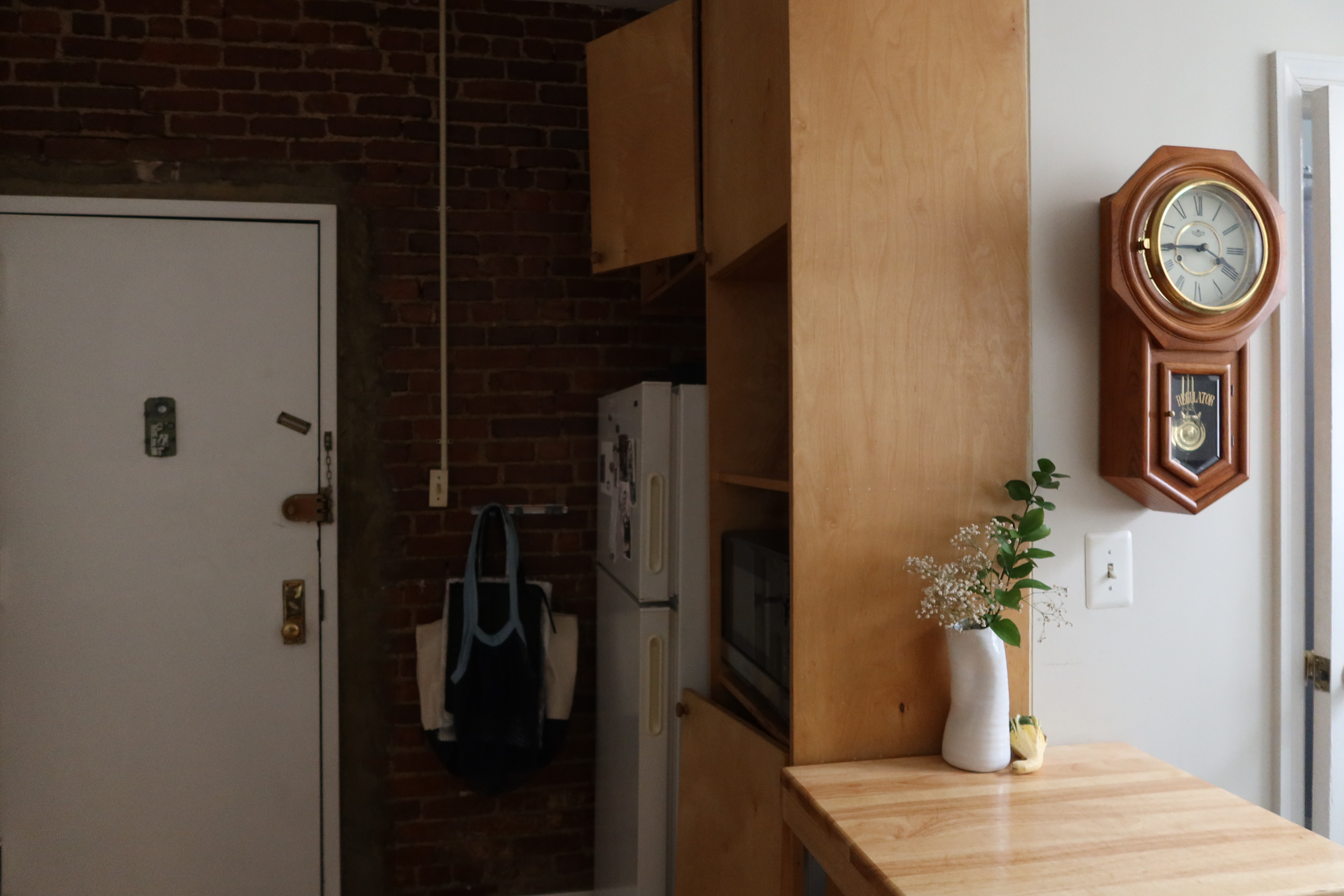 56 Stagg Street, Unit 1A Brooklyn, NY 11206 - Photo 8 of 15 a vase of flowers sitting on a table in a kitchen