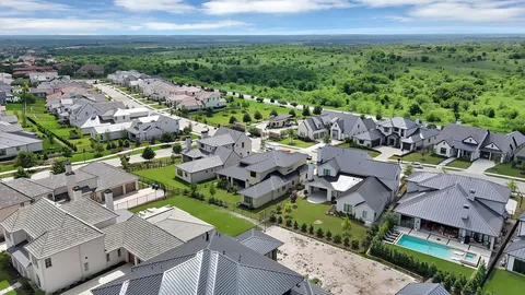 an aerial view of a houses with outdoor space