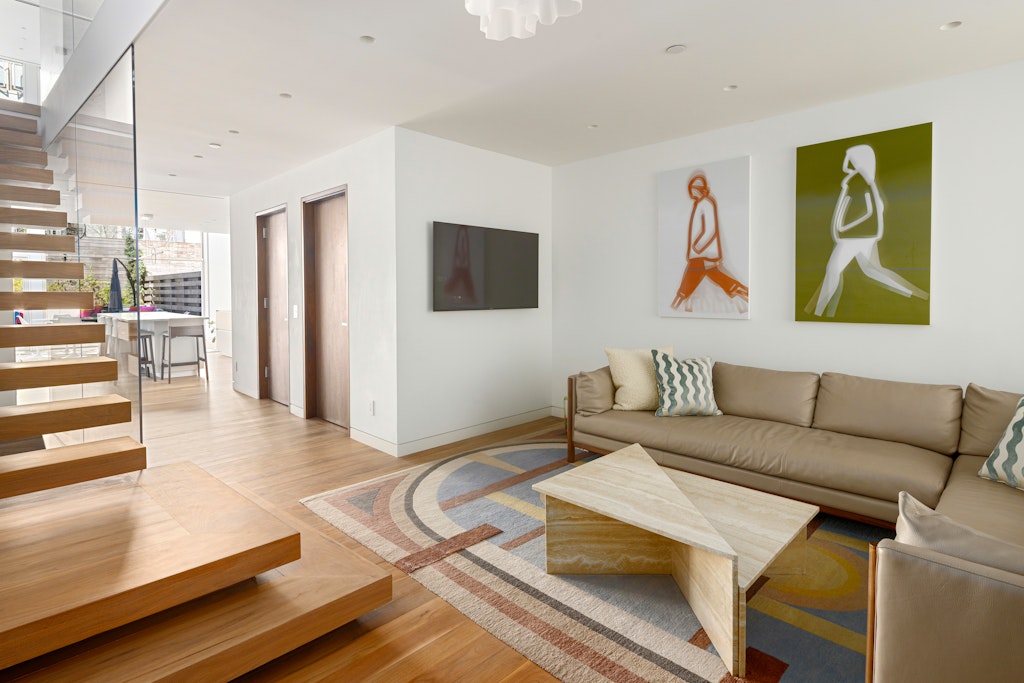 125 West 87th Street Manhattan, NY 10024 - Photo 6 of 27 a living room with furniture and a flat screen tv