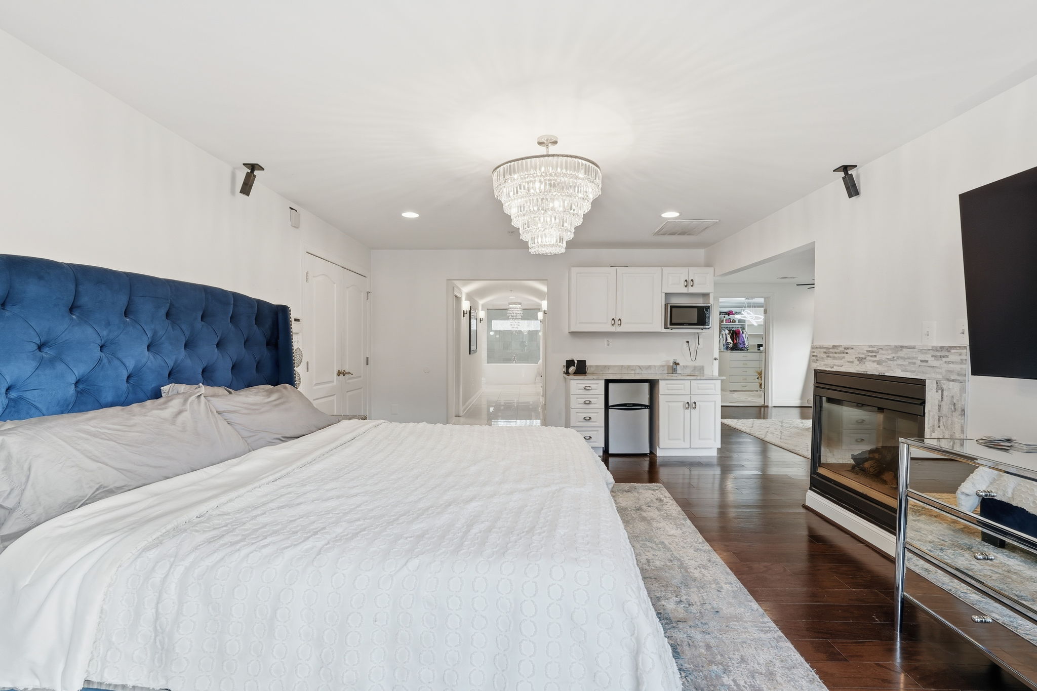 11000 Brooks Reserve Road Upper Marlboro, MD 20772 - Photo 21 of 60 a spacious bedroom with a bed chandelier and a window