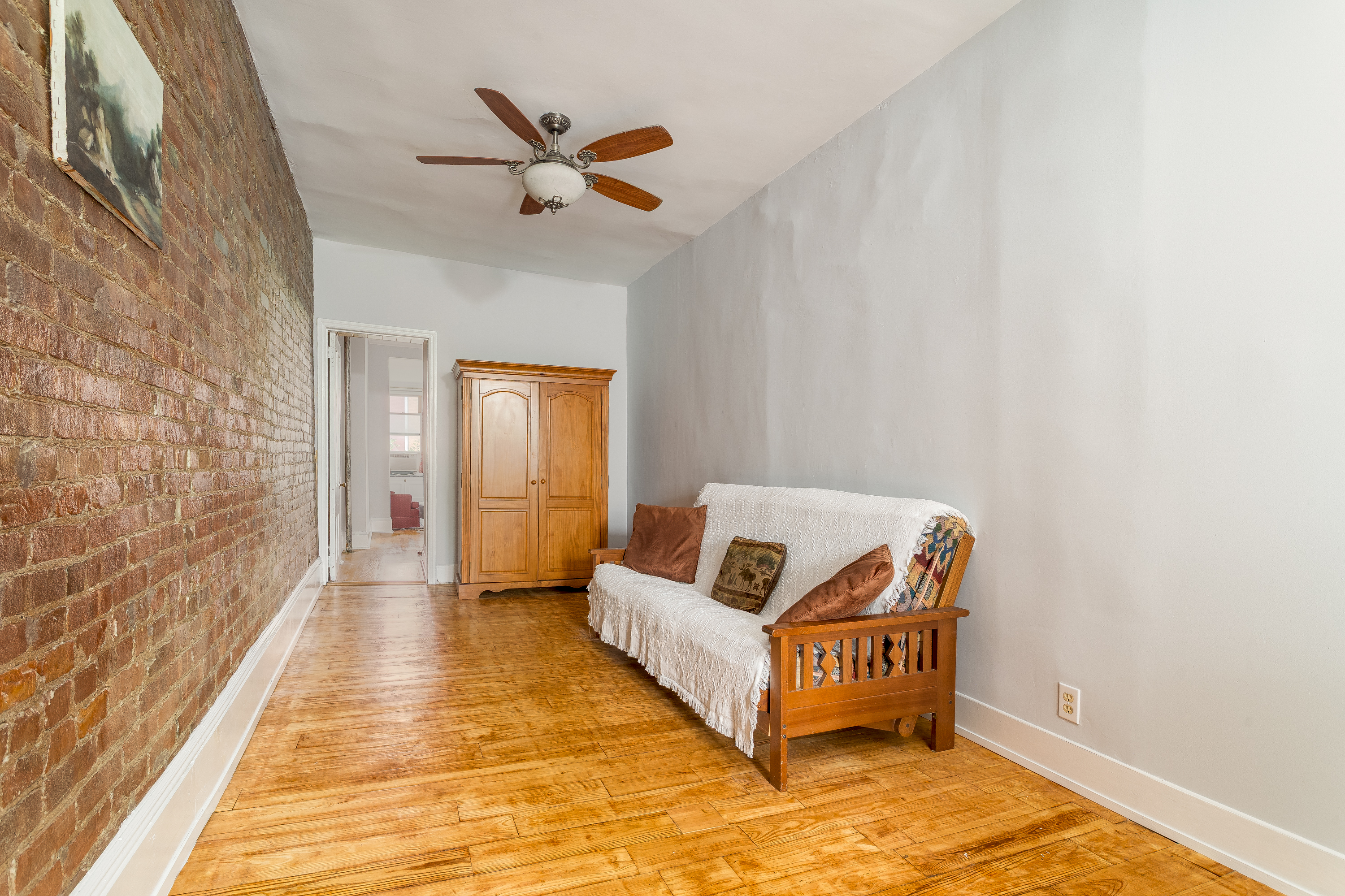 616 East 9th Street, Unit 4W Manhattan, NY 10009 - Photo 10 of 20 a living room with furniture and a rug