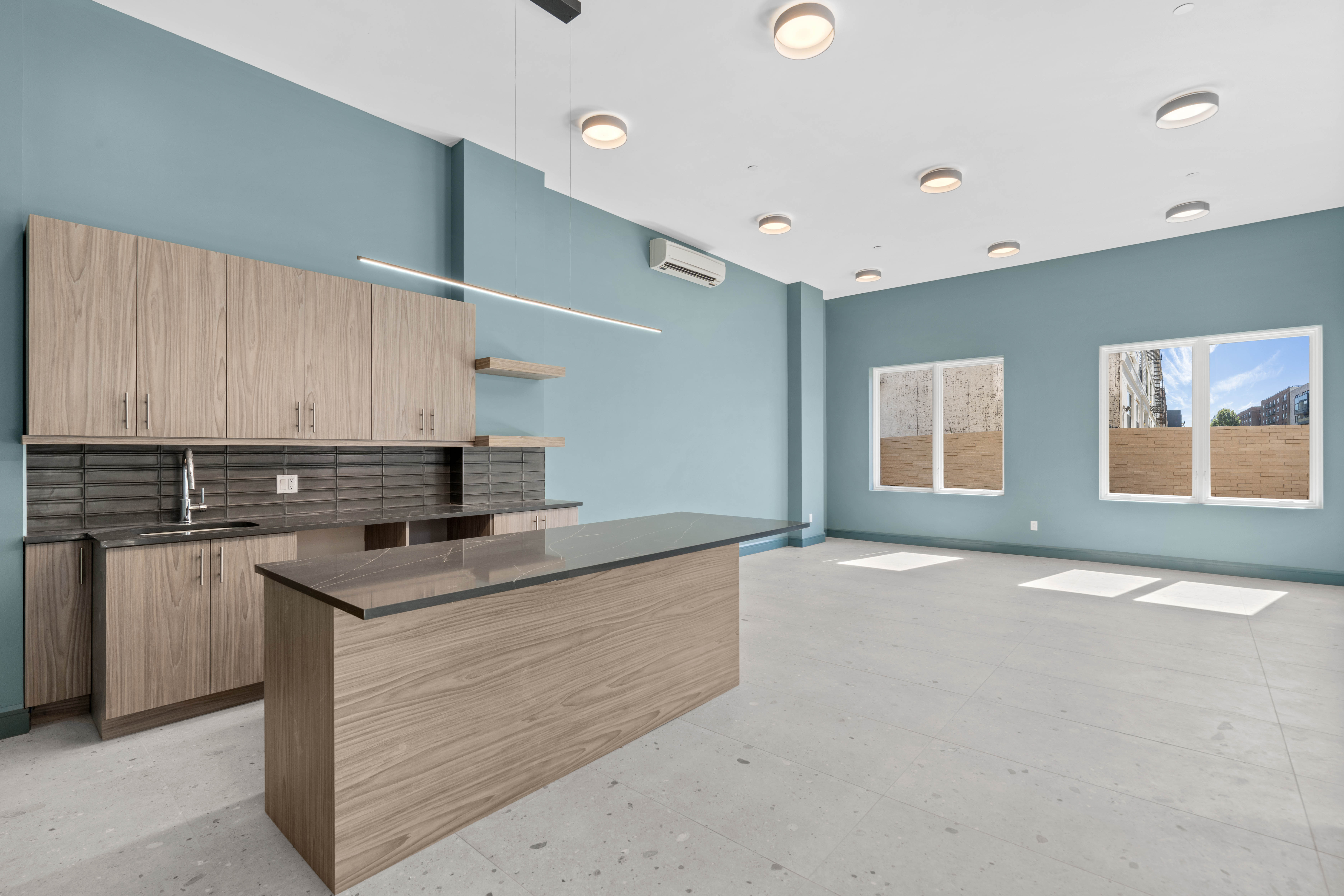 1 Lenox Road, Unit 3A Brooklyn, NY 11226 - Photo 7 of 9 a kitchen with stainless steel appliances granite countertop a sink stove and cabinets