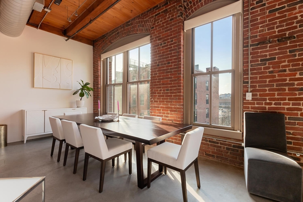 35 Channel Center Street, Unit 402 Boston, MA 02210 - Photo 11 of 35 a dining room with furniture and window