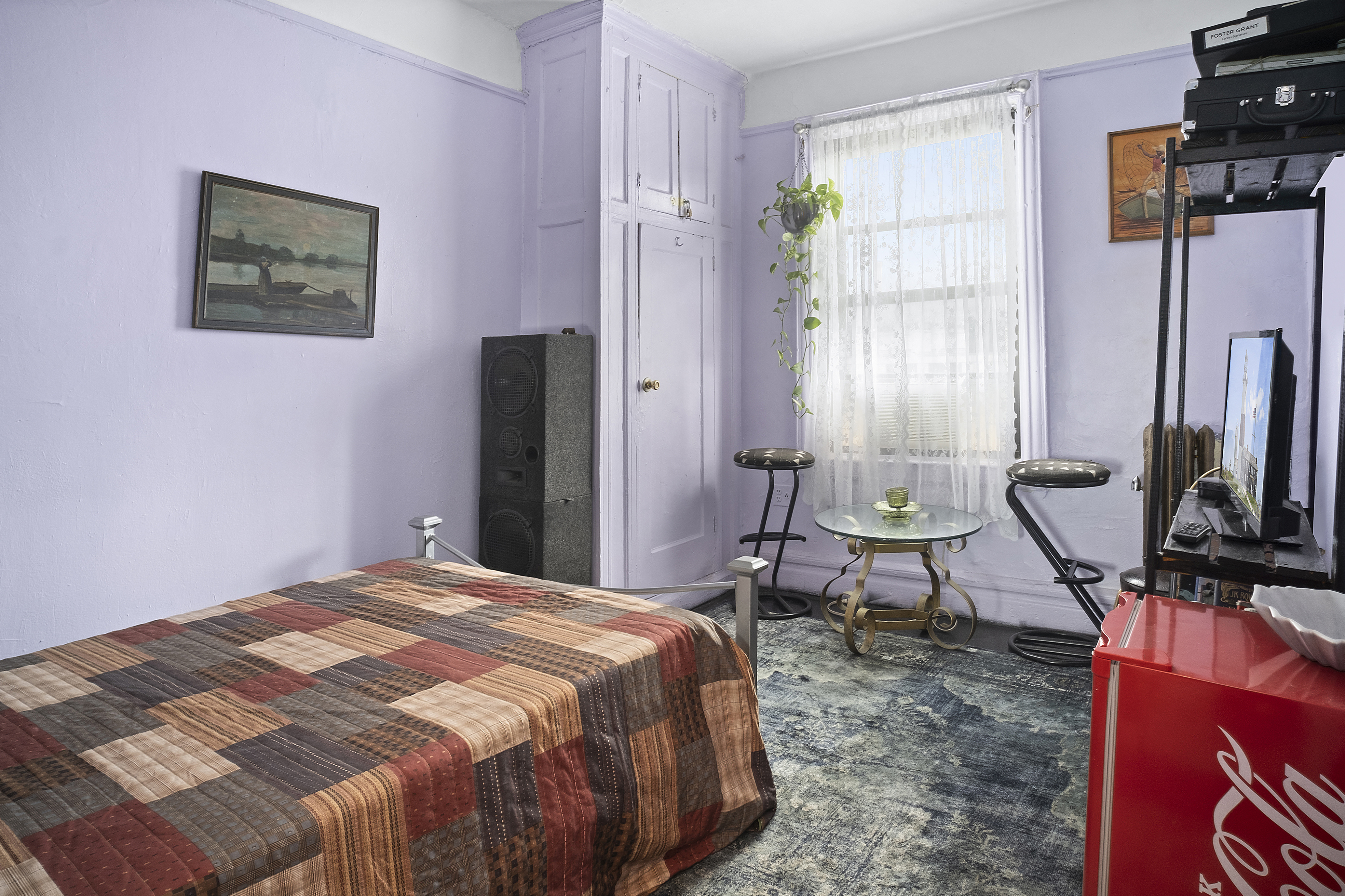 41 Convent Avenue, Unit 4L Manhattan, NY 10027 - Photo 4 of 13 a bedroom with a bed a computer on the desk and a rug