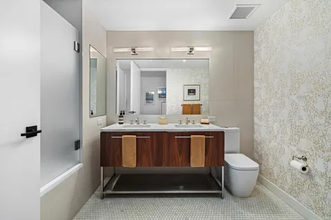 a bathroom with a sink a toilet and a bathtub