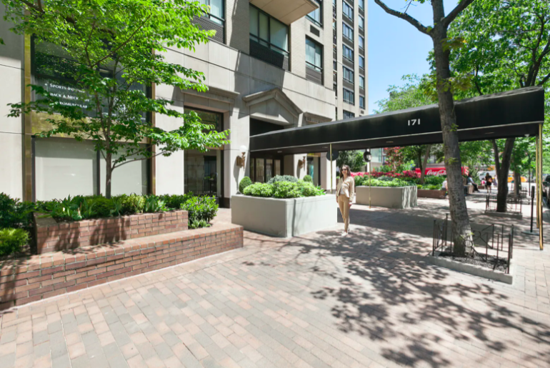 171 East 84th Street, Unit 7B Manhattan, NY 10028 - Photo 17 of 19 a view of a building with a bench in front of it