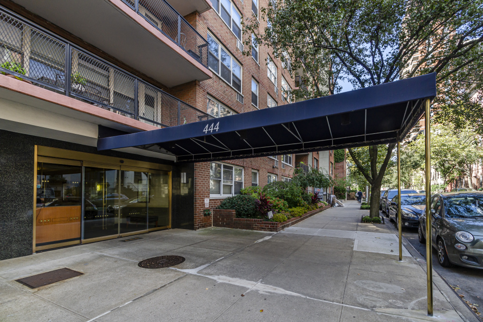 444 East 84th Street, Unit 3F Manhattan, NY 10028 - Photo 1 of 3 a view of a patio with table and chairs under an umbrella
