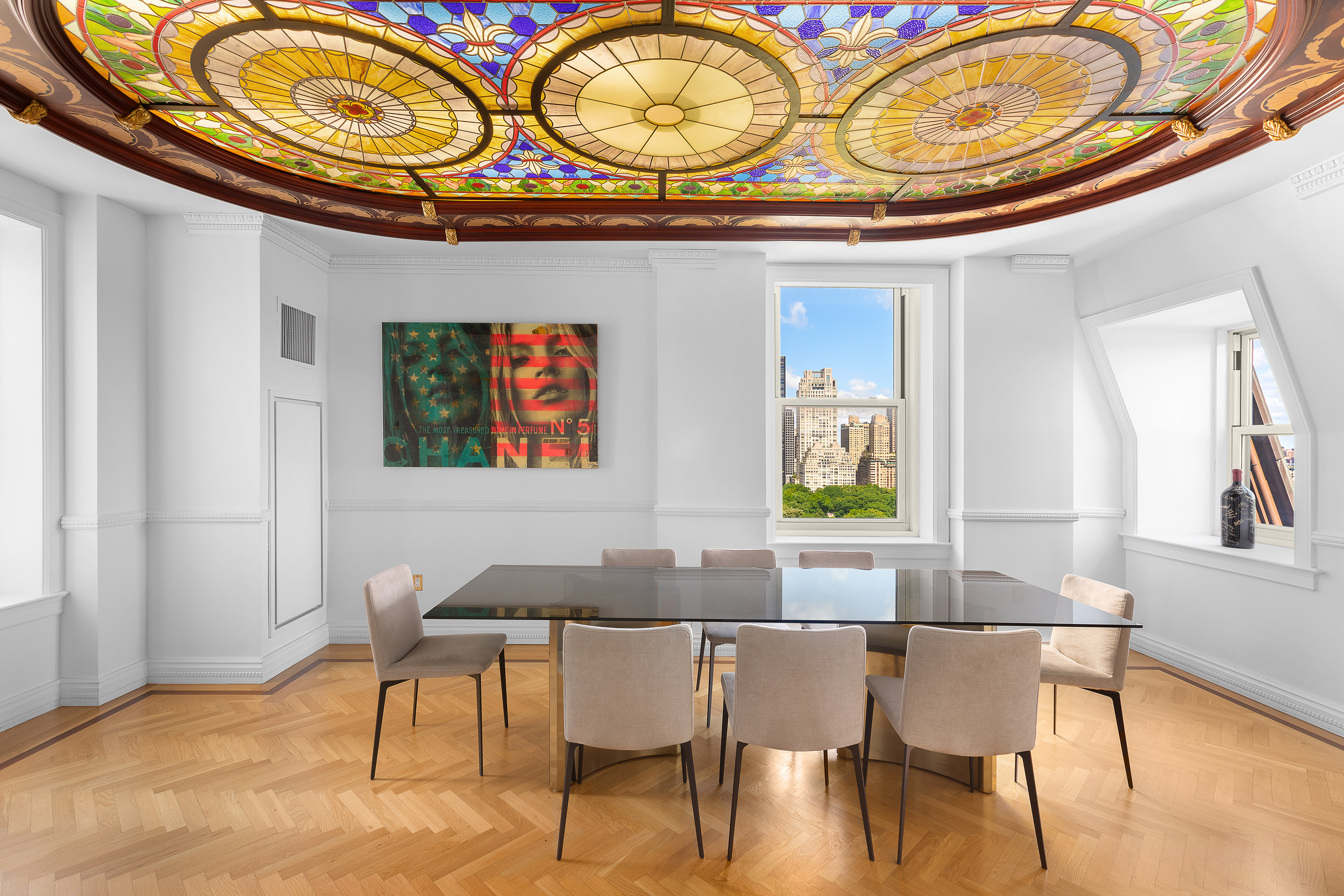 1 Central Park South, Unit 1801 Manhattan, NY 10019 - Photo 8 of 25 a view of a dining room with furniture and chandelier