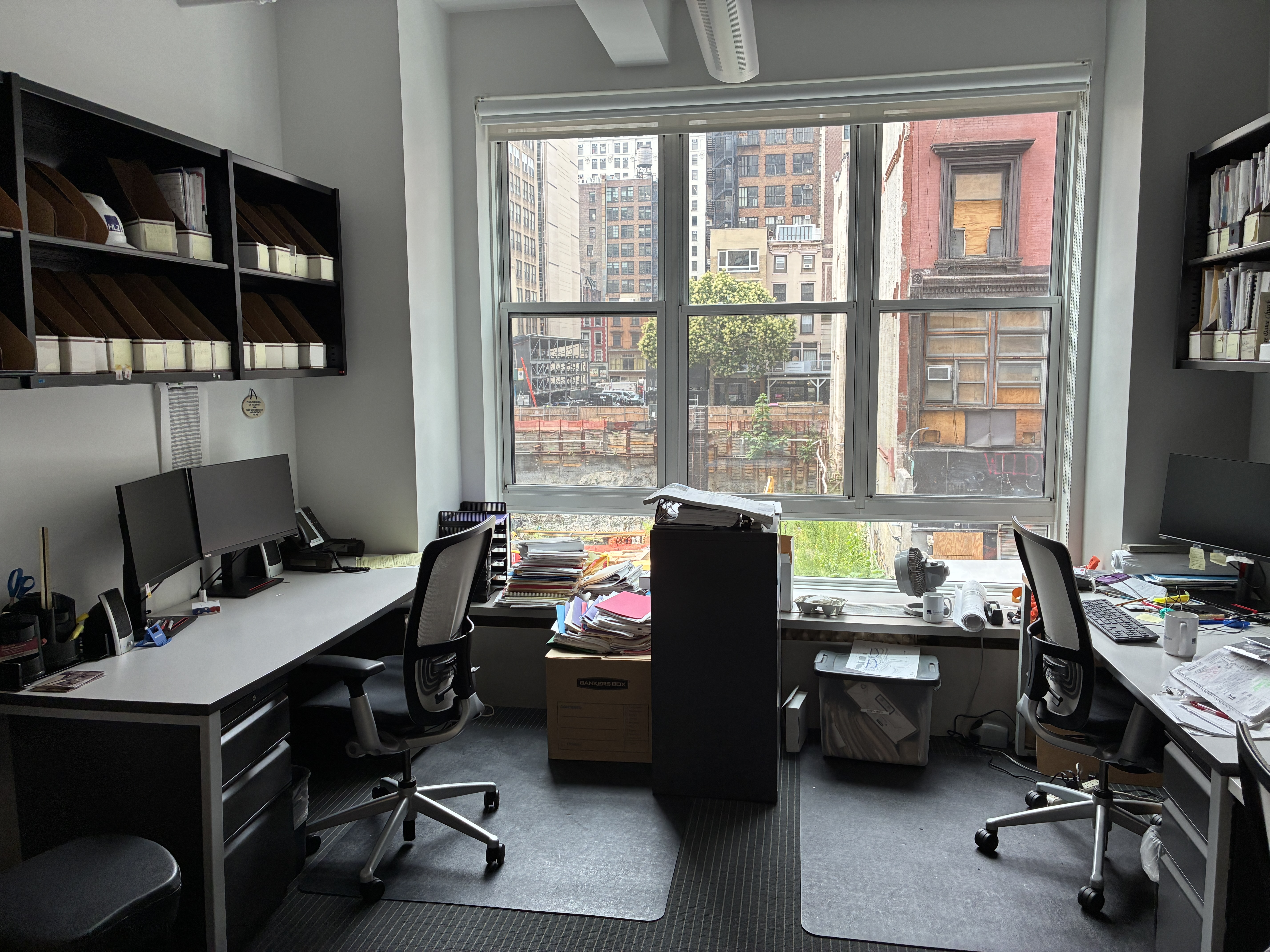 11 West 30th Street, Unit 2F Manhattan, NY 10001 - Photo 10 of 20 a view of a workspace with furniture and a window