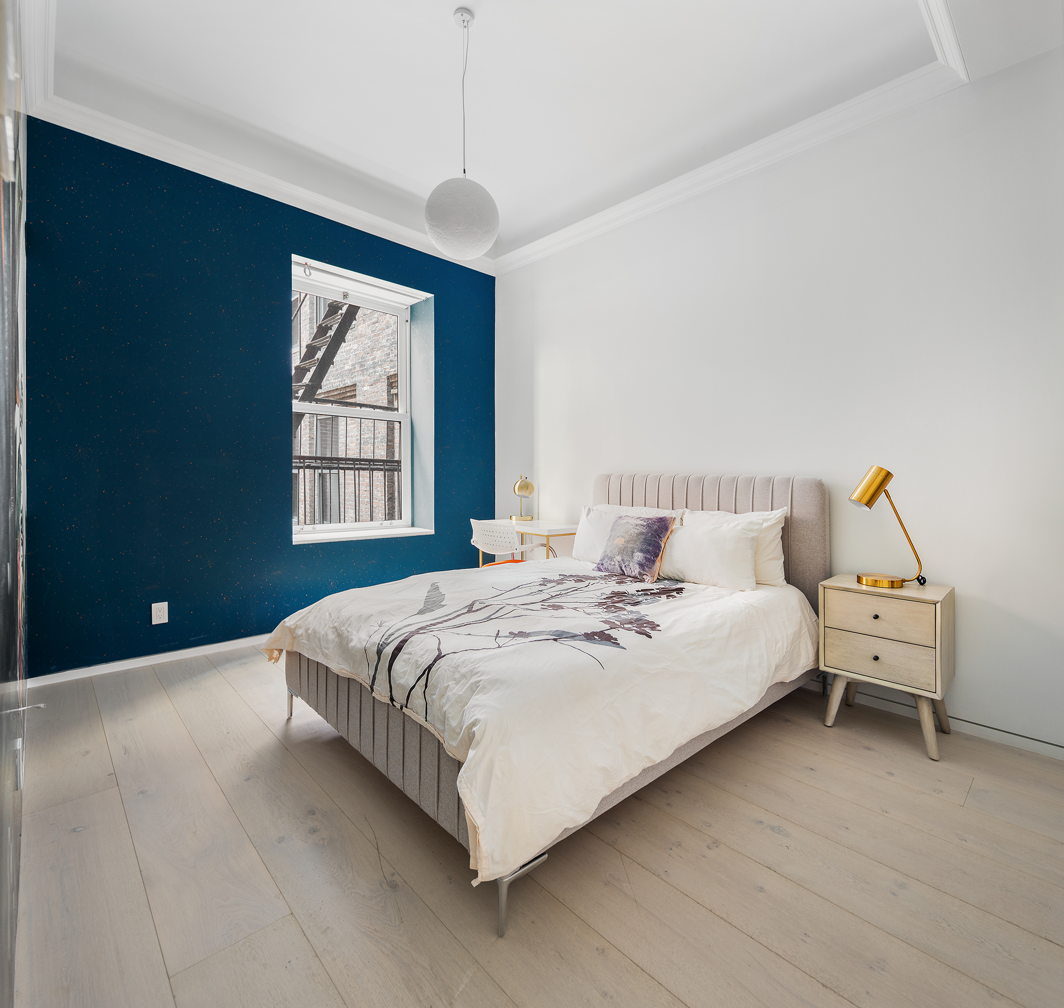 26 West 20th Street, Unit 3 Manhattan, NY 10011 - Photo 9 of 19 a bed room with a bed and a window