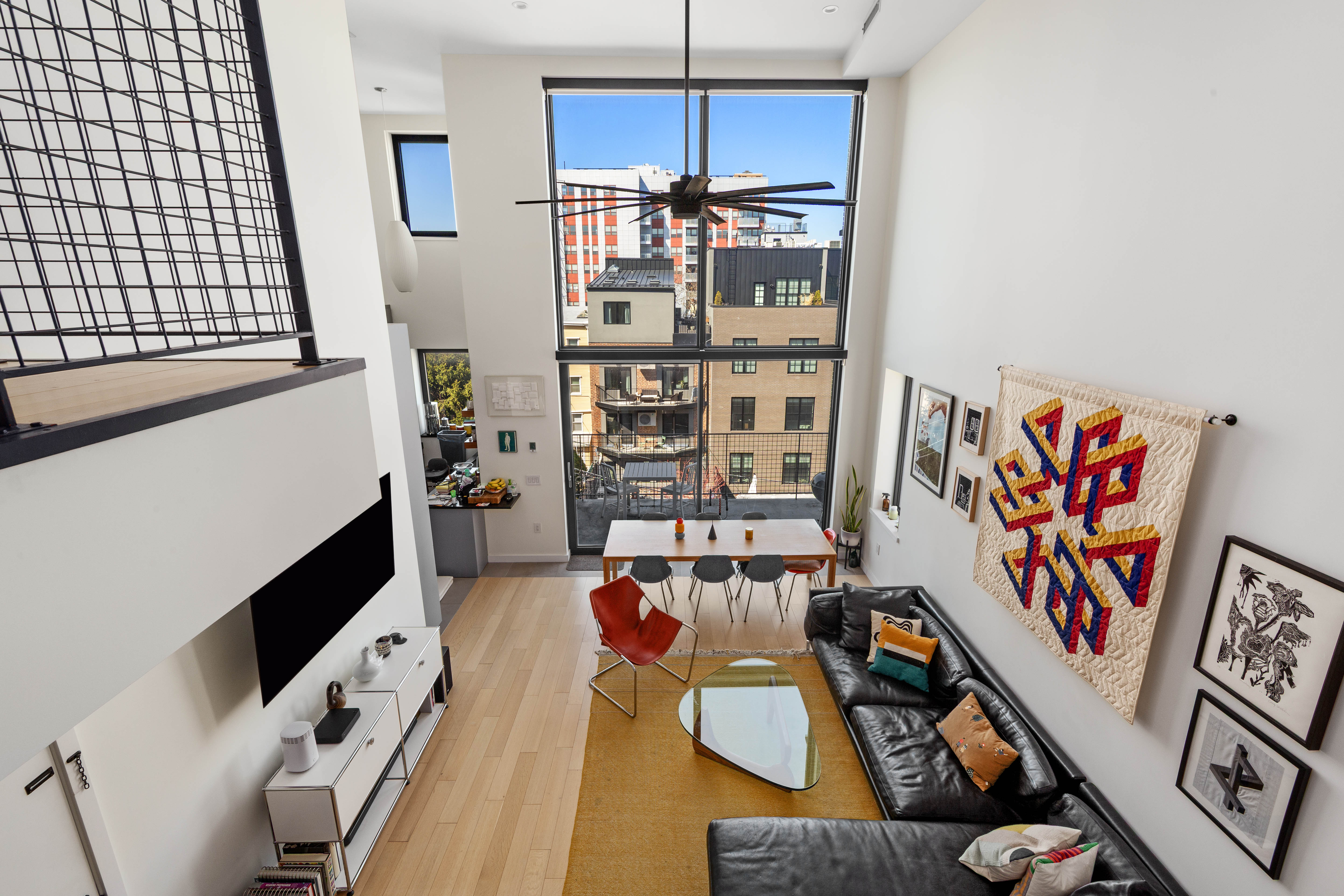 33 Conselyea Street, Unit PH Brooklyn, NY 11211 - Photo 2 of 16 a living room with furniture cabinets and window