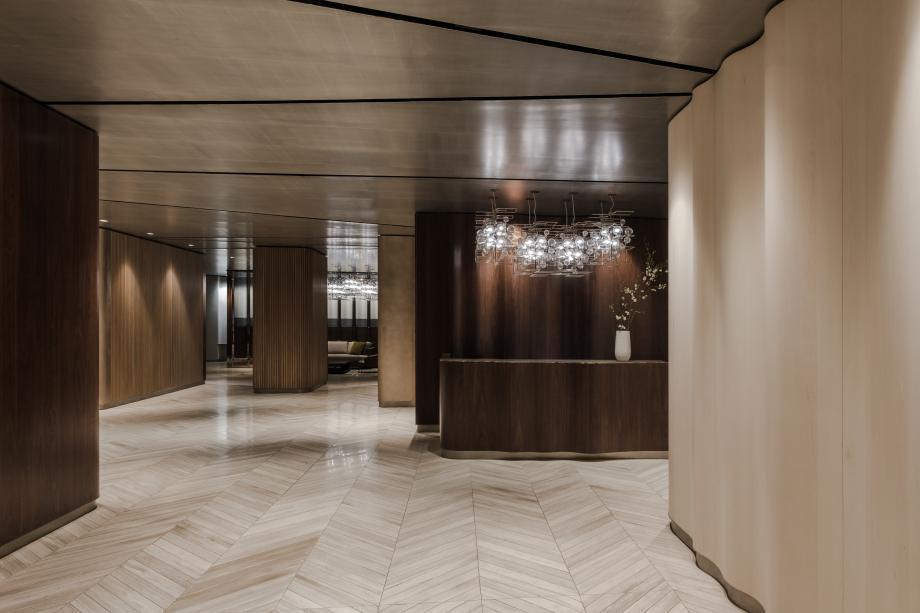 252 7th Avenue, Unit 10I Manhattan, NY 10001 - Photo 21 of 25 a view of a hallway with wooden floor and a fire place