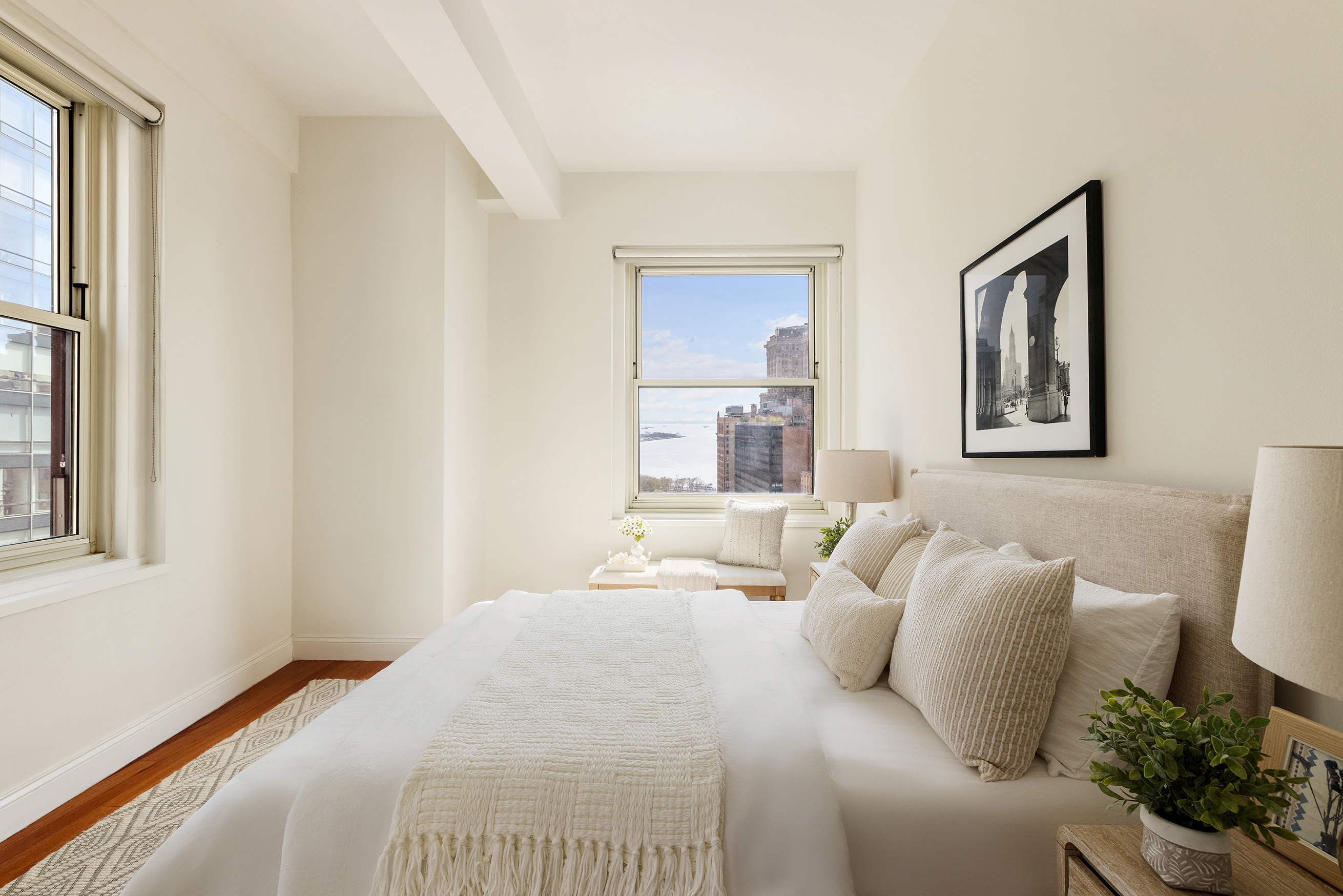 88 Greenwich Street, Unit 2206 Manhattan, NY 10006 - Photo 4 of 16 a bedroom with a large bed and a painting on the wall