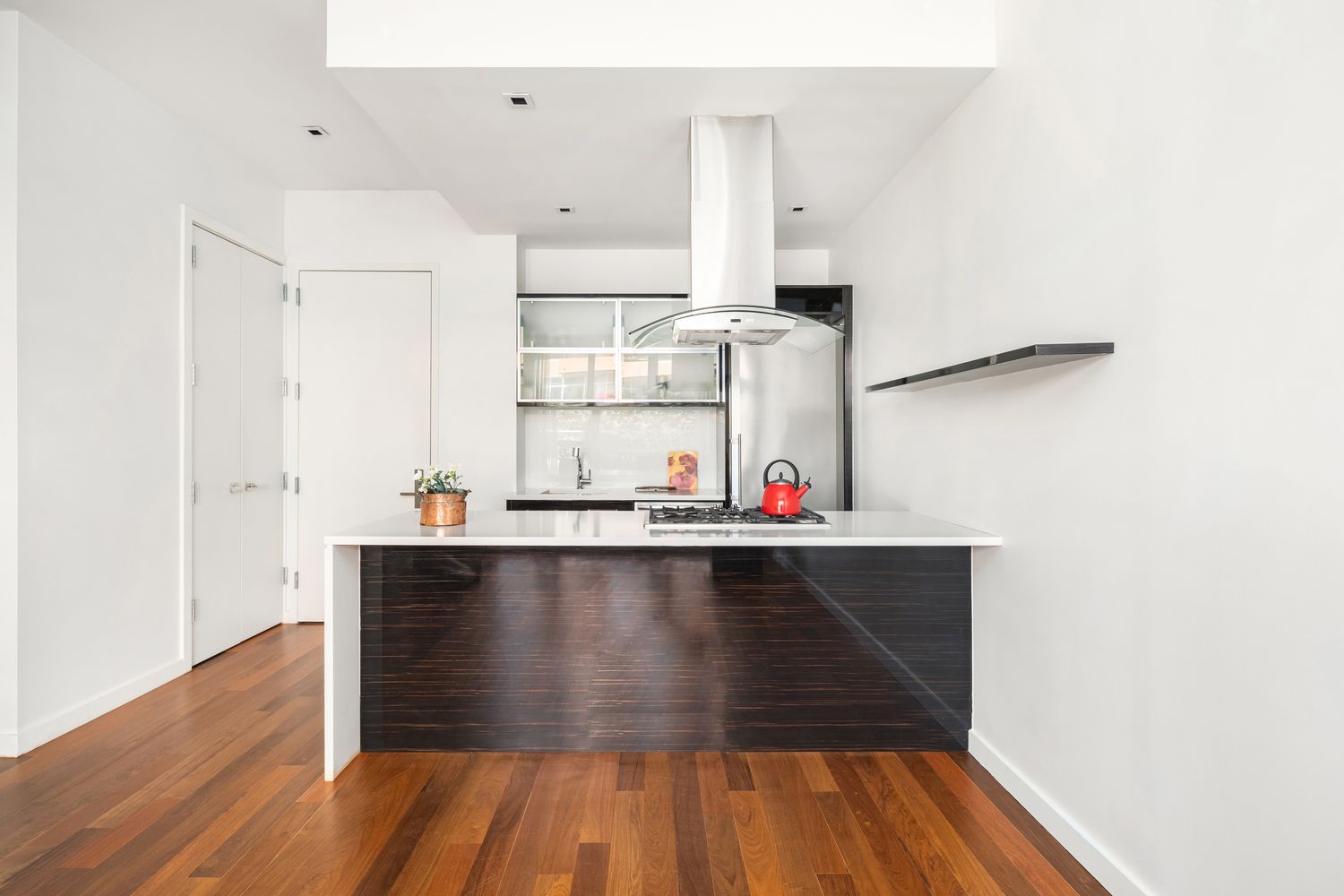 135 North 11th Street, Unit 2F Brooklyn, NY 11249 - Photo 2 of 10 a view of kitchen island with wooden floor and electronic appliances
