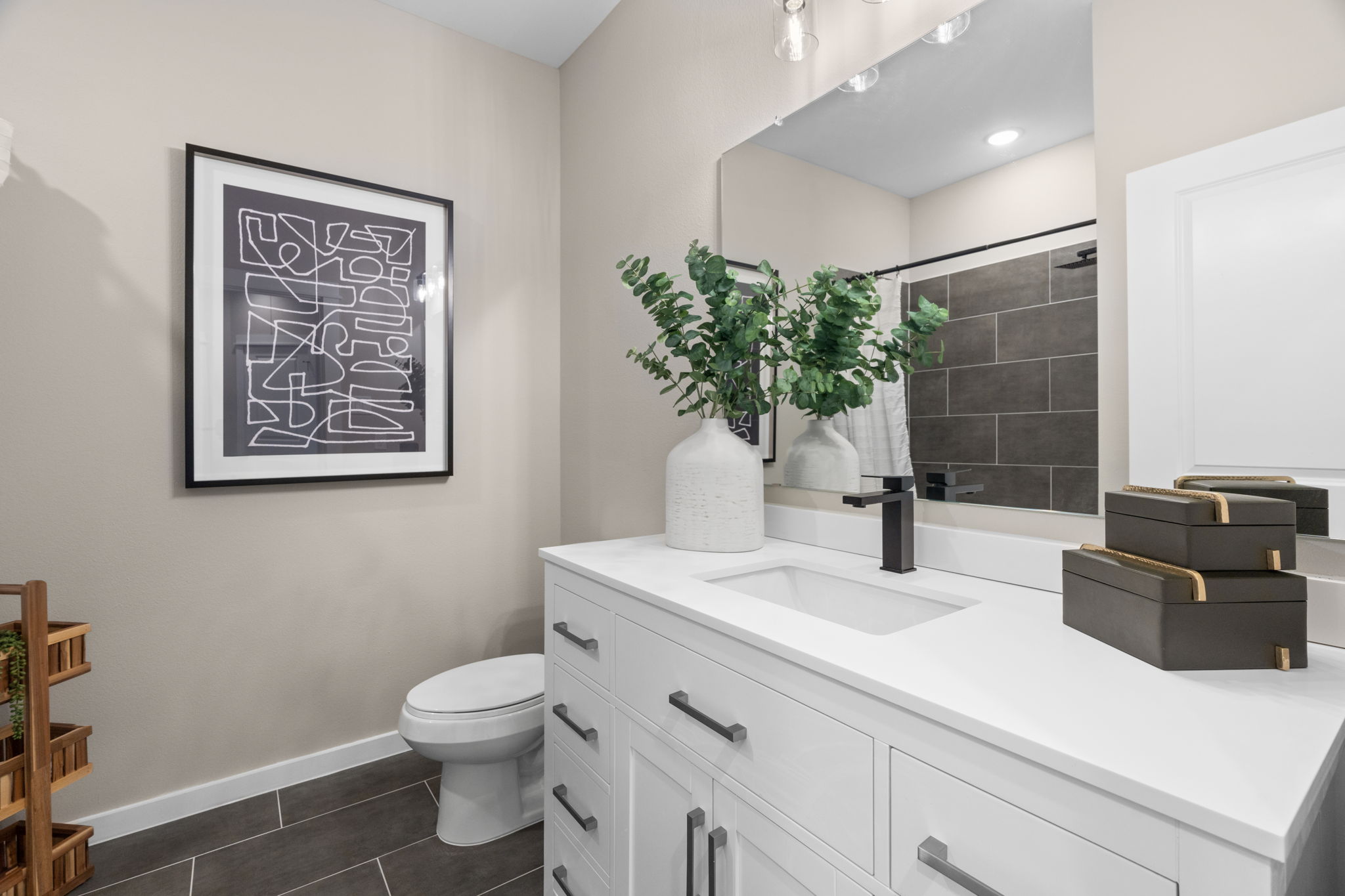 11303 Stonework Grv Lane Houston, TX 77076 - Photo 33 of 39 a bathroom with a sink a toilet and mirror