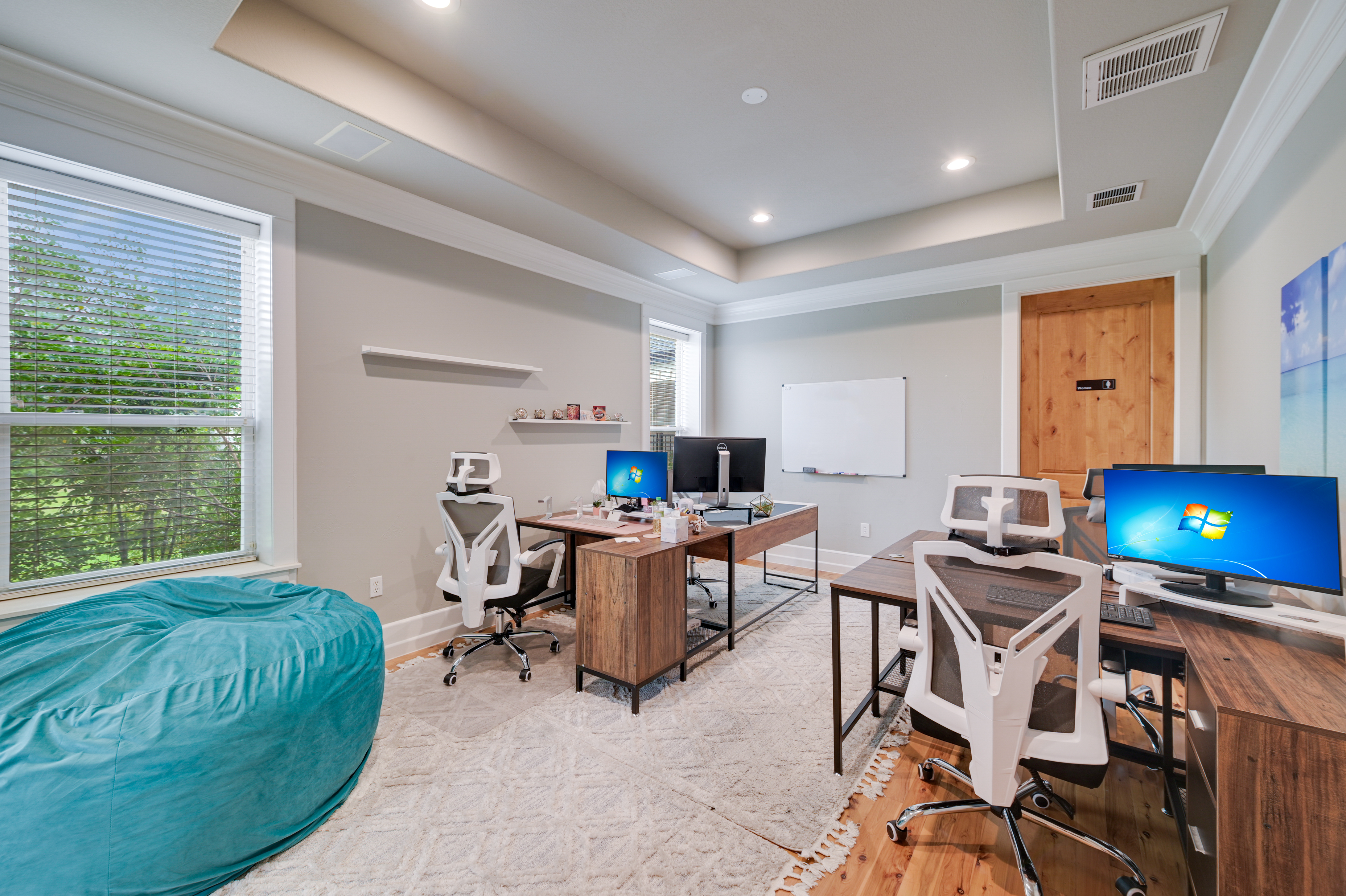 14913 Murfin Road Austin, TX 78734 - Photo 16 of 40 a view of a workspace with furniture and a window