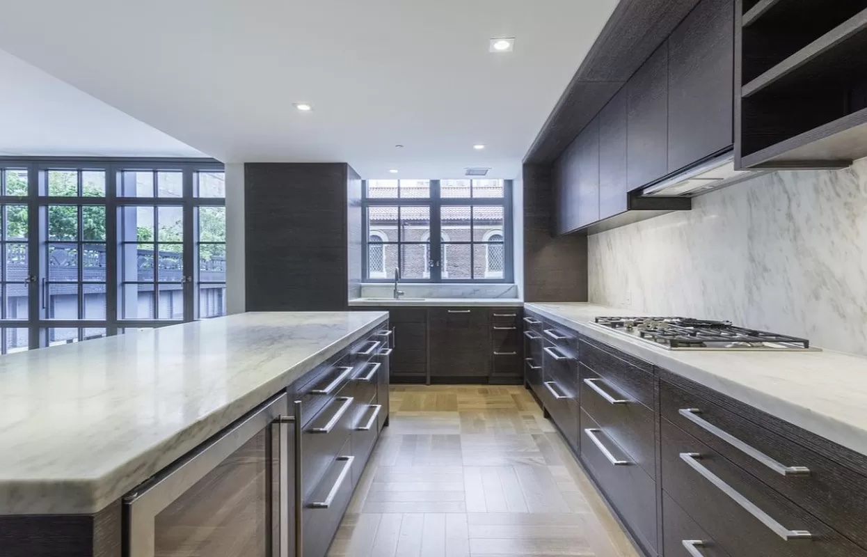 500 West 21st Street, Unit 3A Manhattan, NY 10011 - Photo 4 of 11 a kitchen with a stove and a sink
