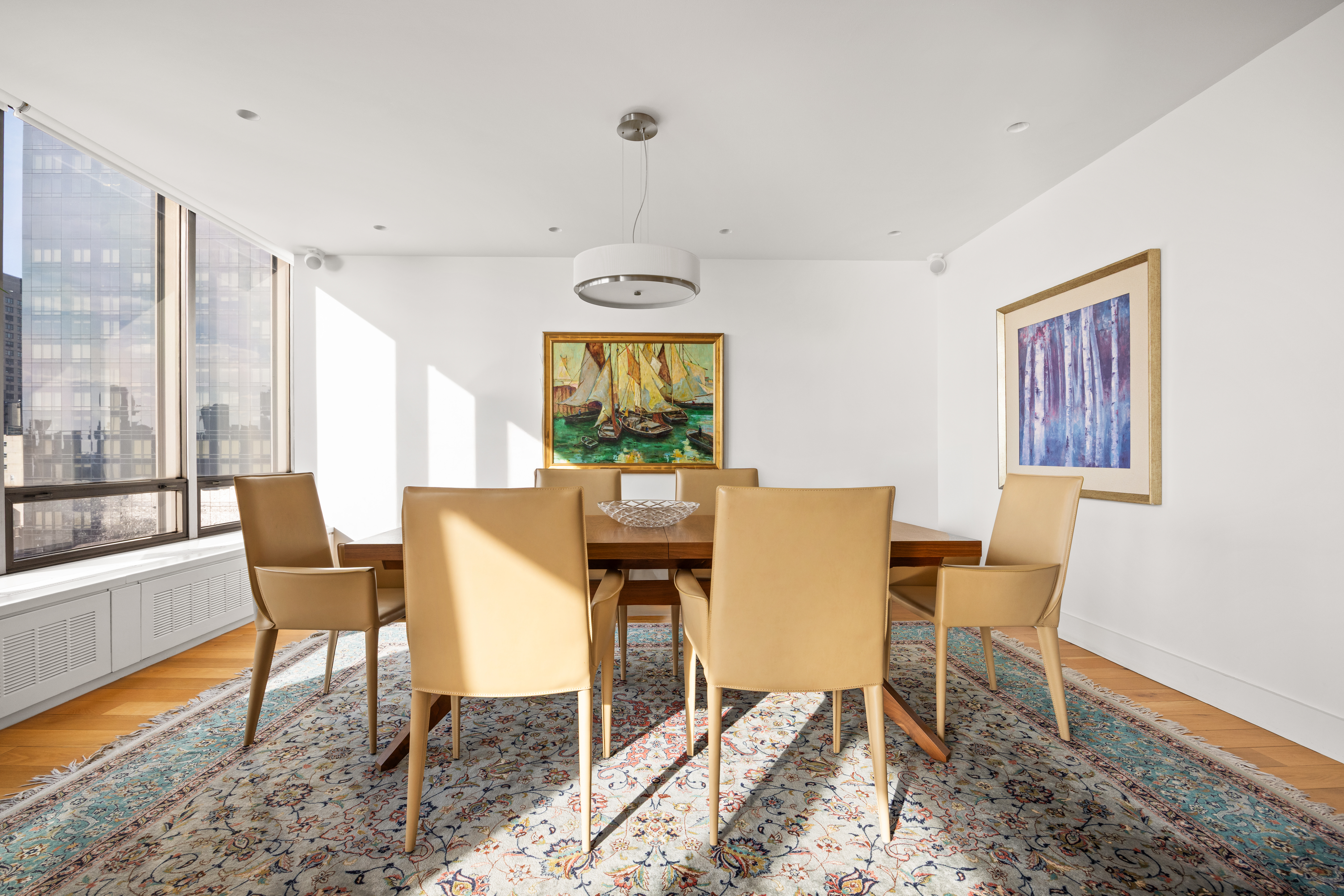 860 United Nations Plaza, Unit 16G Manhattan, NY 10017 - Photo 6 of 12 a work room with furniture and a window