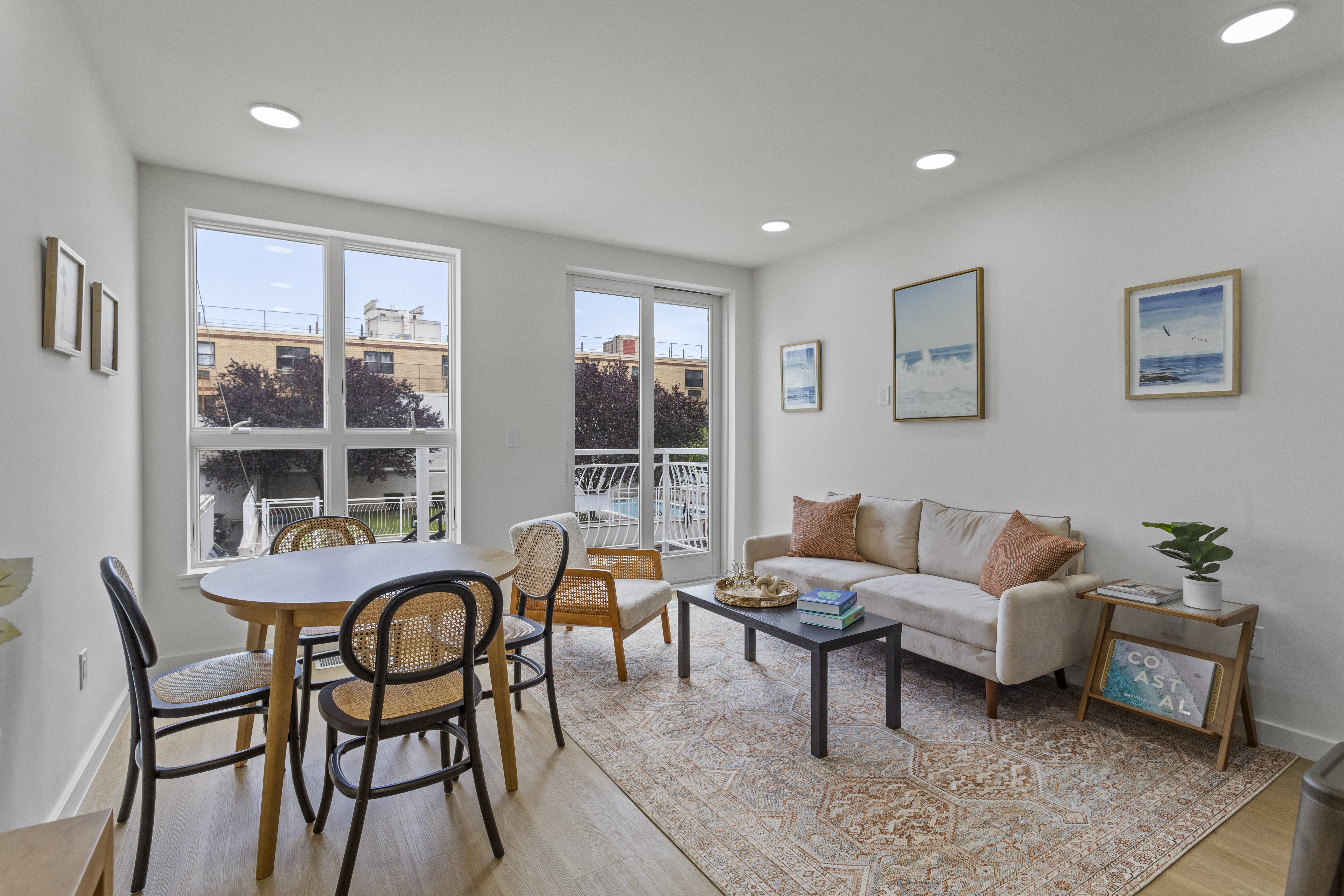 3112 Emmons Avenue, Unit 3140A-2 Brooklyn, NY 11235 - Photo 2 of 13 a living room with furniture and a window