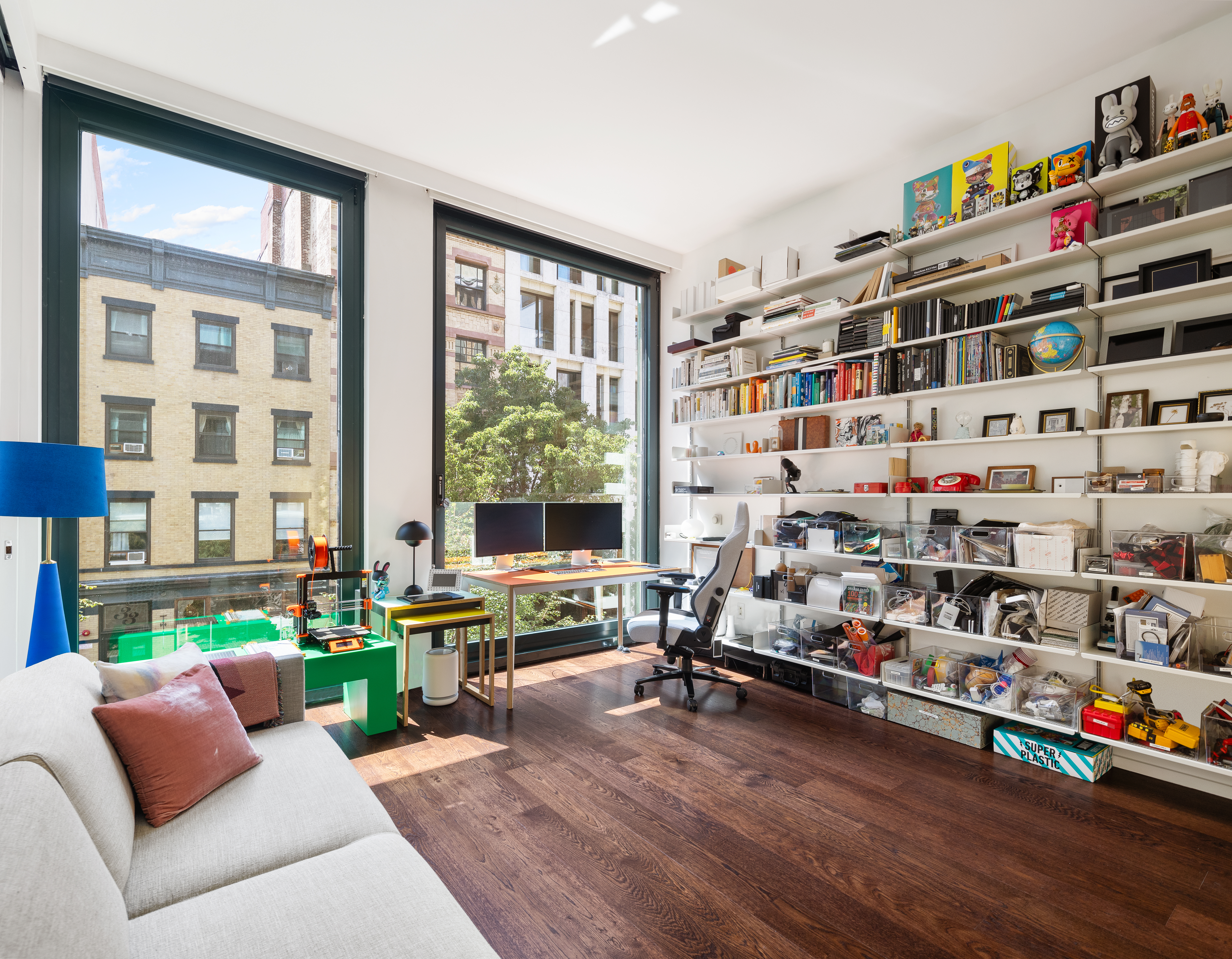 40 Bond Street, Unit 4B Manhattan, NY 10012 - Photo 7 of 9 a living room with lots of furniture and a wooden floor