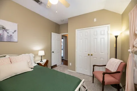 a bedroom with a bed and furniture