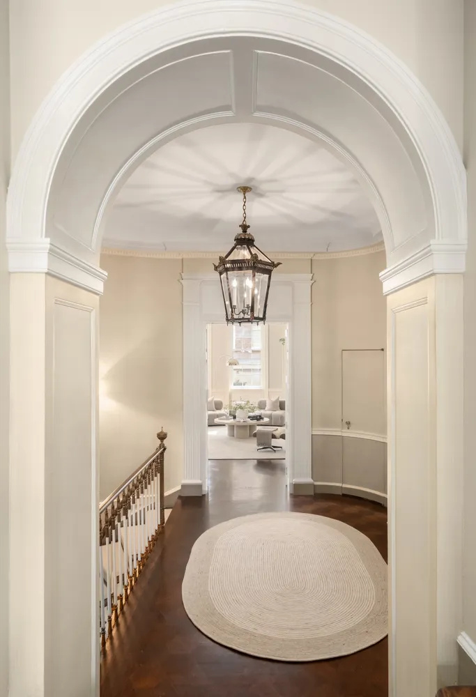 a living room with fireplace furniture and a window