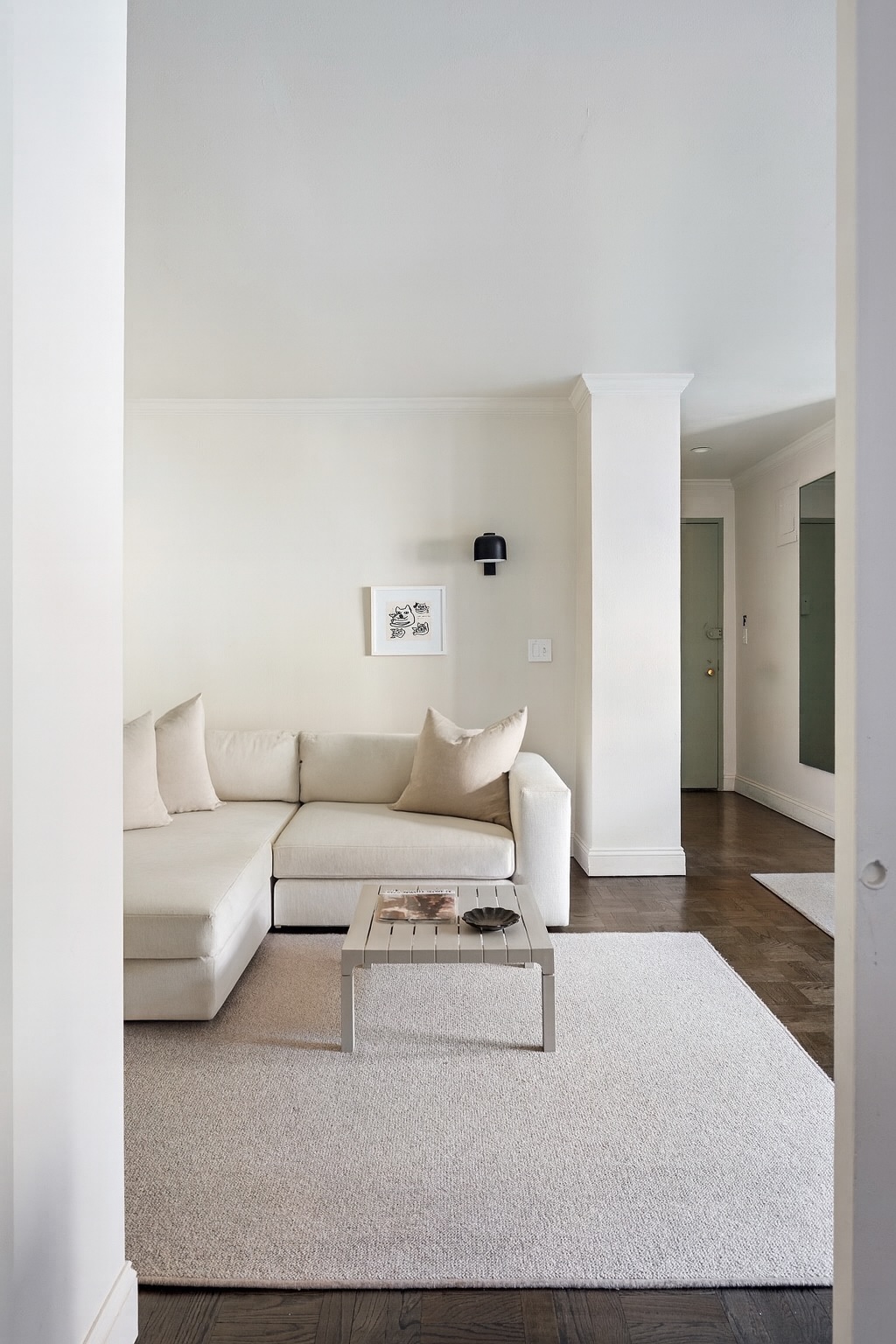 123 East 75th Street, Unit 6B Manhattan, NY 10021 - Photo 4 of 13 a living room with furniture and a couch