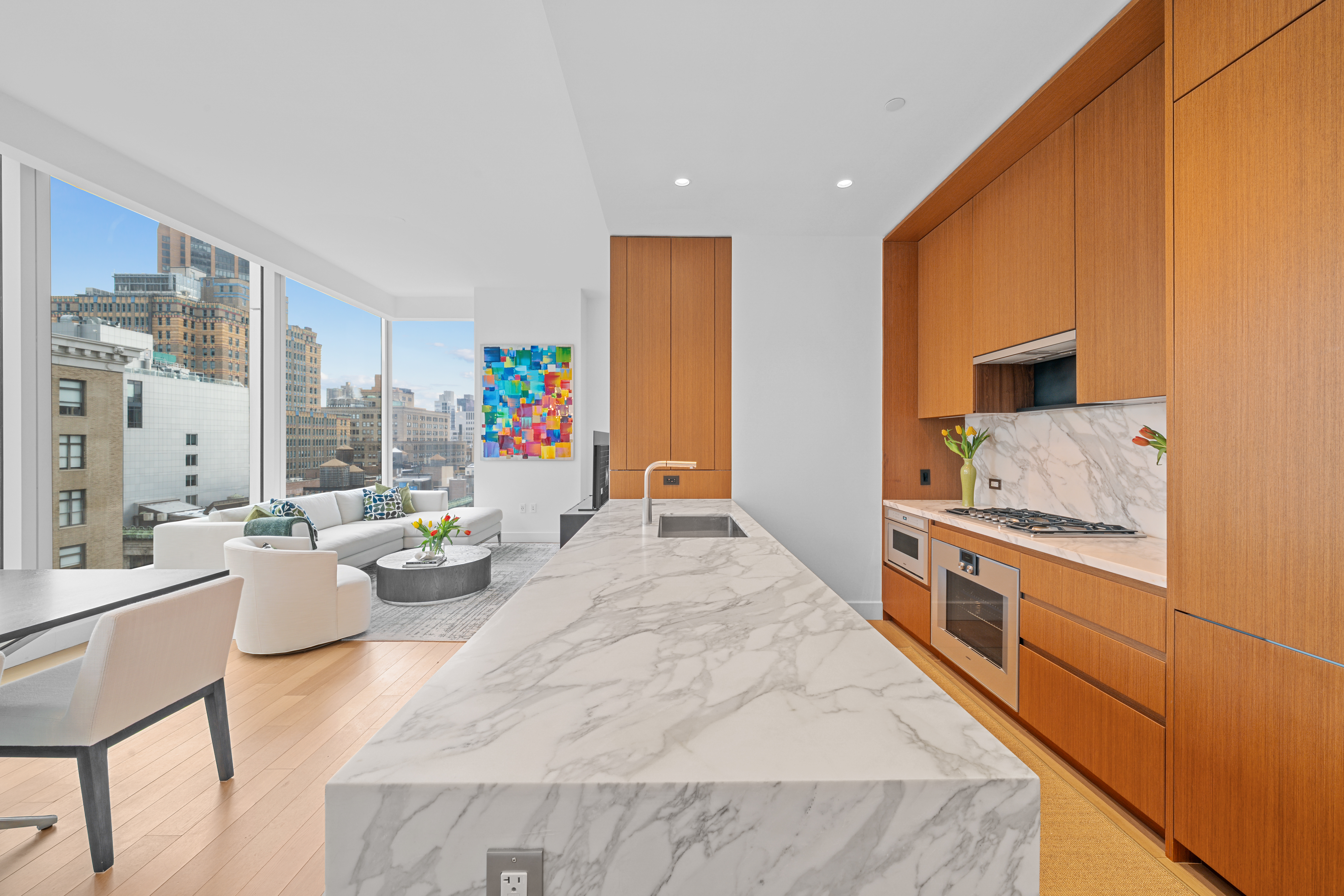 15 East 30th Street, Unit 19B Manhattan, NY 10016 - Photo 14 of 40 a bed room with a bed and a couch
