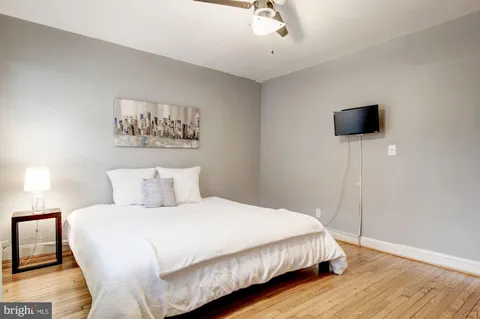 a bedroom with a bed and a cabinets